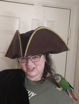 Tanya dressed as pirate with bird on shoulder